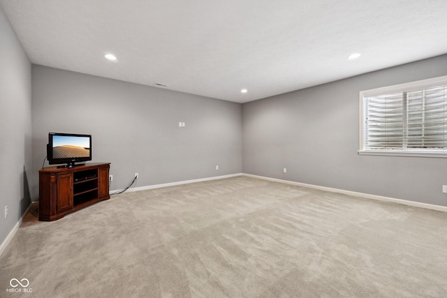 10806 Solis Cir, Fishers, IN 46038 - unfurnished living room with light colored carpet and recessed lighting