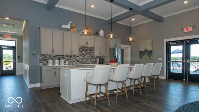 2892 Maricopa Blvd, Whitestown, IN 46075 - kitchen with stainless steel fridge, beamed ceiling, french doors, light countertops, and a spacious island