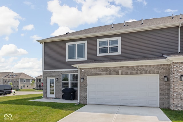 2892 Maricopa Blvd, Whitestown, IN 46075 - view of front of house featuring brick siding, driveway, a front lawn, and a garage