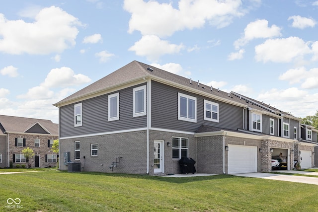 2892 Maricopa Blvd, Whitestown, IN 46075 - view of front of house featuring driveway, an attached garage, brick siding, and a front yard