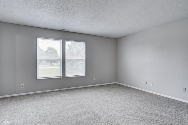 8030 Cork Bend Ln, Indianapolis, IN 46239 - carpeted spare room with a textured ceiling and baseboards