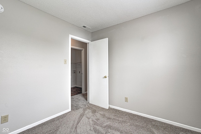 8030 Cork Bend Ln, Indianapolis, IN 46239 - unfurnished room featuring carpet, baseboards, and a textured ceiling
