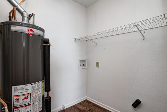 8030 Cork Bend Ln, Indianapolis, IN 46239 - washroom with gas water heater, dark wood-type flooring, hookup for a washing machine, and baseboards