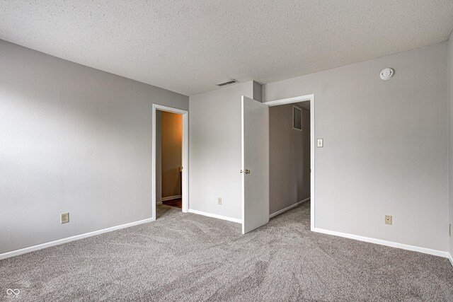 8030 Cork Bend Ln, Indianapolis, IN 46239 - carpeted spare room featuring a smoke detector, baseboards, and a textured ceiling