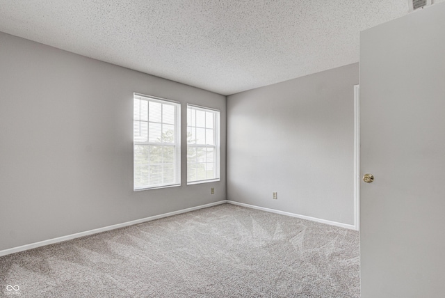 8030 Cork Bend Ln, Indianapolis, IN 46239 - carpeted spare room with a textured ceiling and baseboards