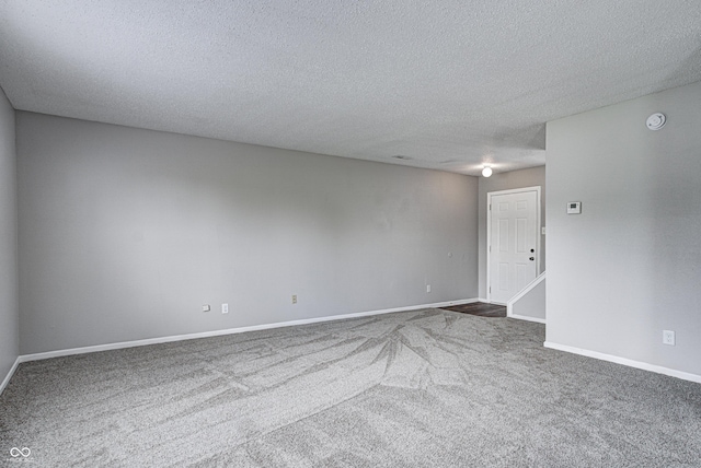 8030 Cork Bend Ln, Indianapolis, IN 46239 - carpeted empty room with a textured ceiling, baseboards, and a smoke detector