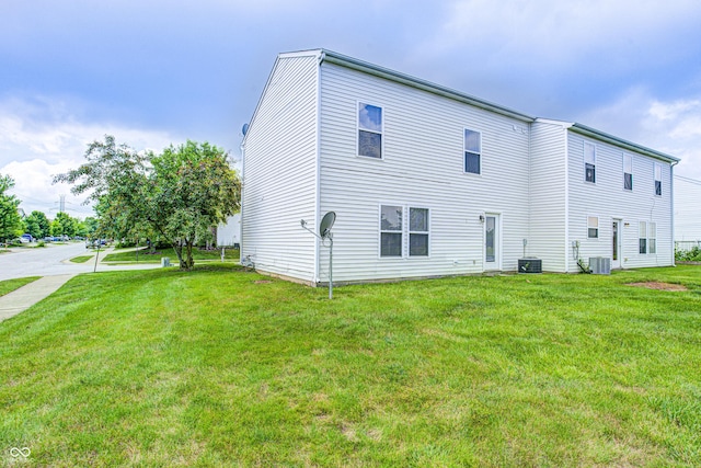 8030 Cork Bend Ln, Indianapolis, IN 46239 - view of side of property featuring central AC unit and a yard