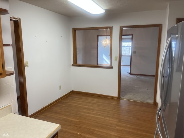 5632 Spring Mist Cir, Indianapolis, IN 46237 - unfurnished room featuring wood finished floors and baseboards