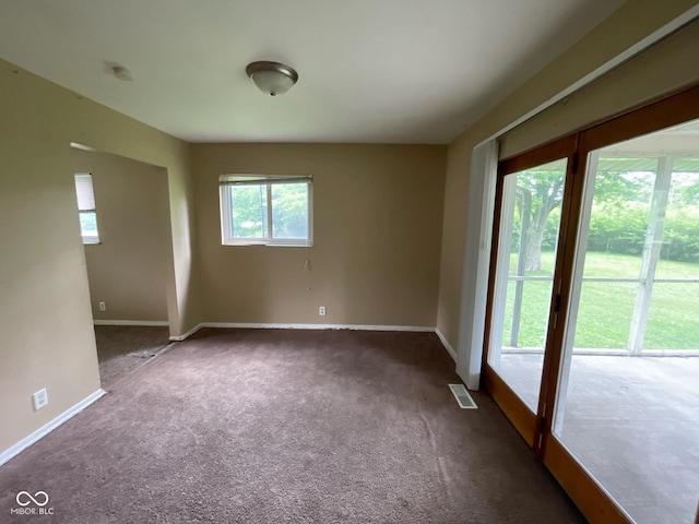 1749 N Graham Ave, Indianapolis, IN 46218 - carpeted spare room featuring baseboards