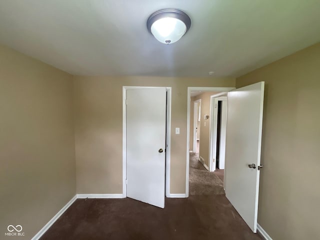 1749 N Graham Ave, Indianapolis, IN 46218 - unfurnished bedroom with carpet floors and baseboards