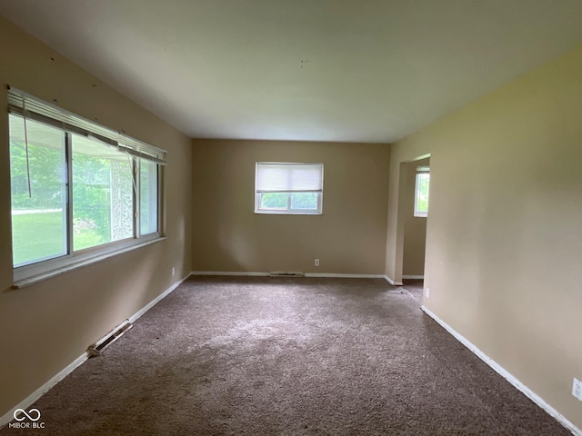 1749 N Graham Ave, Indianapolis, IN 46218 - carpeted empty room with baseboards