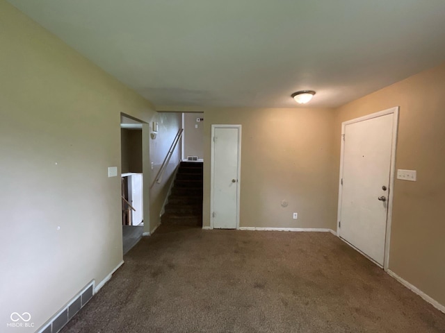 1749 N Graham Ave, Indianapolis, IN 46218 - spare room featuring stairs and carpet flooring
