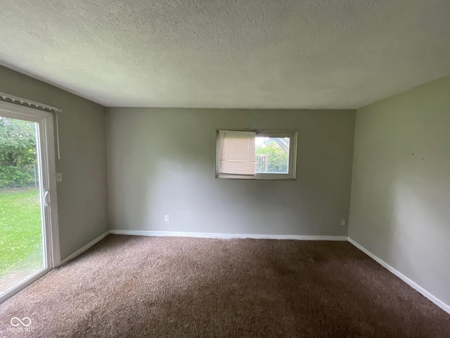 9045 Stardust Dr, Indianapolis, IN 46229 - spare room featuring carpet and a textured ceiling