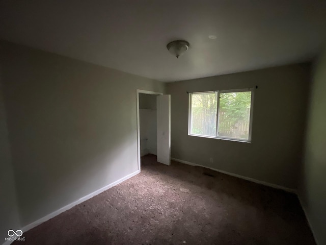 9045 Stardust Dr, Indianapolis, IN 46229 - unfurnished bedroom featuring carpet and a closet