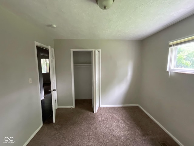 9045 Stardust Dr, Indianapolis, IN 46229 - unfurnished bedroom featuring a closet and carpet