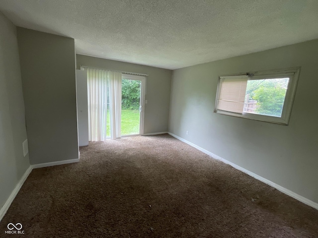 9045 Stardust Dr, Indianapolis, IN 46229 - empty room with carpet flooring and a textured ceiling