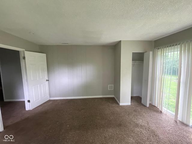 9045 Stardust Dr, Indianapolis, IN 46229 - unfurnished bedroom with multiple windows, carpet floors, a closet, and a textured ceiling