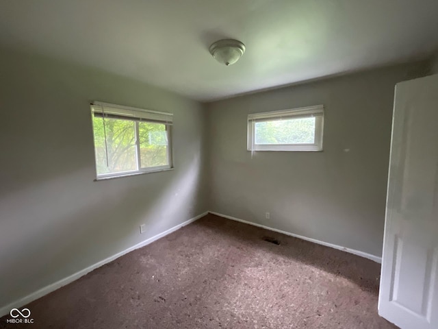 9045 Stardust Dr, Indianapolis, IN 46229 - carpeted empty room with baseboards