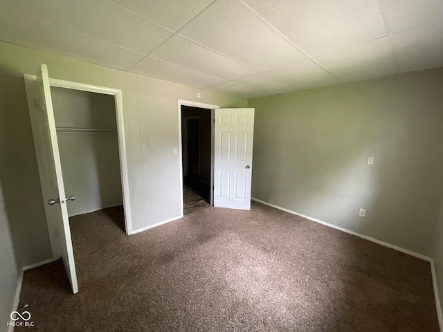 9045 Stardust Dr, Indianapolis, IN 46229 - unfurnished bedroom featuring a drop ceiling, carpet floors, and a closet