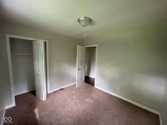 9045 Stardust Dr, Indianapolis, IN 46229 - unfurnished bedroom featuring carpet flooring and a closet