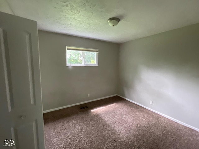 9045 Stardust Dr, Indianapolis, IN 46229 - unfurnished room with carpet floors and a textured ceiling