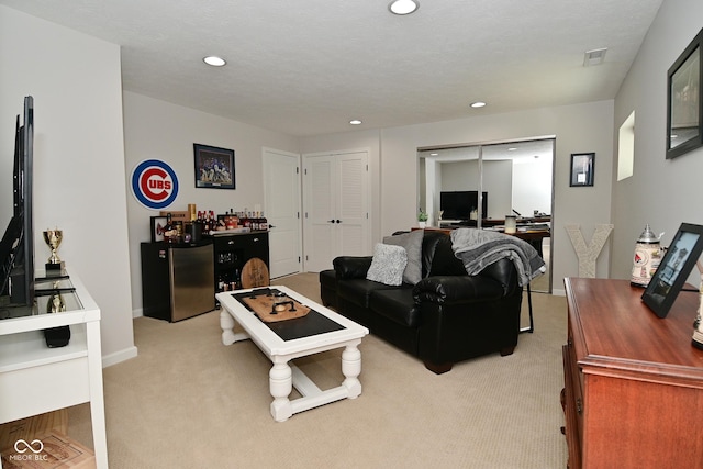 13616 Whitten Dr N, Fishers, IN 46037 - living room with a bar, light colored carpet, recessed lighting, and an office area