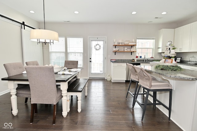 13616 Whitten Dr N, Fishers, IN 46037 - dining area with recessed lighting, a barn door, and dark wood-type flooring
