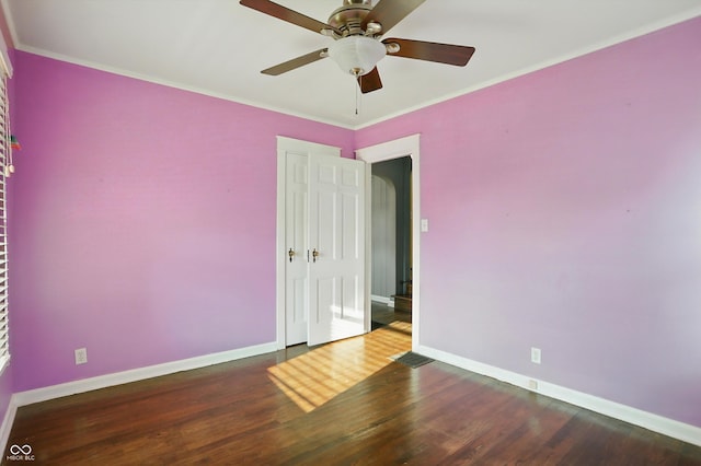 808 N Layman Ave, Indianapolis, IN 46219 - spare room with wood finished floors, ceiling fan, and ornamental molding