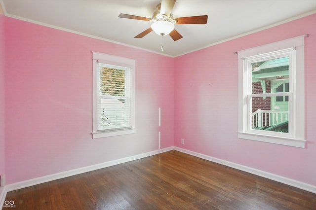 808 N Layman Ave, Indianapolis, IN 46219 - empty room featuring dark wood-type flooring, ornamental molding, and a ceiling fan