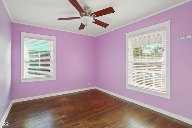 808 N Layman Ave, Indianapolis, IN 46219 - unfurnished room with healthy amount of natural light, dark wood-style floors, a ceiling fan, and crown molding