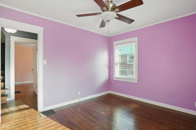 808 N Layman Ave, Indianapolis, IN 46219 - empty room with wood finished floors, a ceiling fan, and crown molding