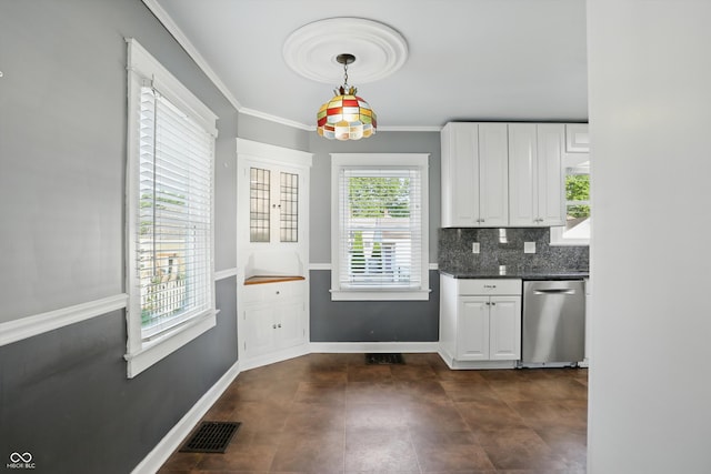 808 N Layman Ave, Indianapolis, IN 46219 - kitchen featuring dishwasher, dark countertops, white cabinetry, backsplash, and hanging light fixtures