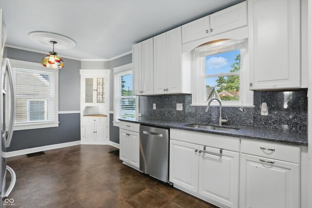 808 N Layman Ave, Indianapolis, IN 46219 - kitchen with stainless steel dishwasher, white cabinetry, tasteful backsplash, and ornamental molding