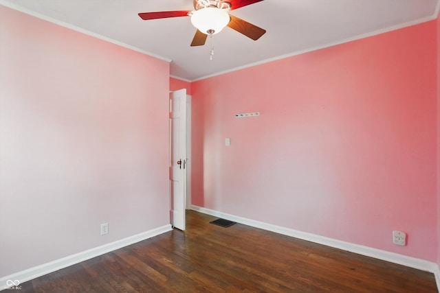 808 N Layman Ave, Indianapolis, IN 46219 - empty room featuring dark wood-style flooring, a ceiling fan, and crown molding