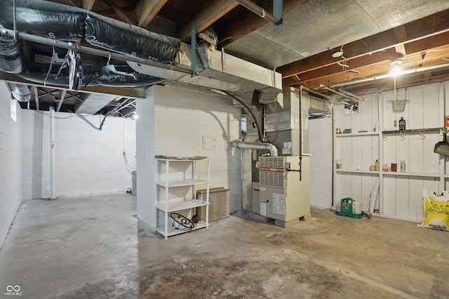 808 N Layman Ave, Indianapolis, IN 46219 - unfinished below grade area featuring heating unit and concrete block wall