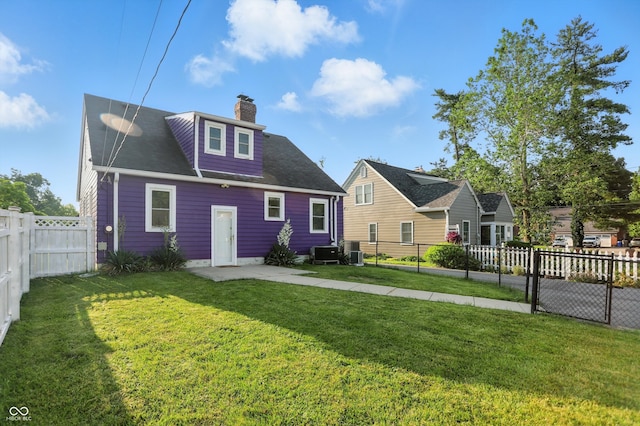 808 N Layman Ave, Indianapolis, IN 46219 - back of property with a chimney and a fenced backyard