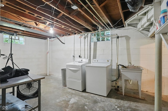 808 N Layman Ave, Indianapolis, IN 46219 - basement with washing machine and dryer and a sink