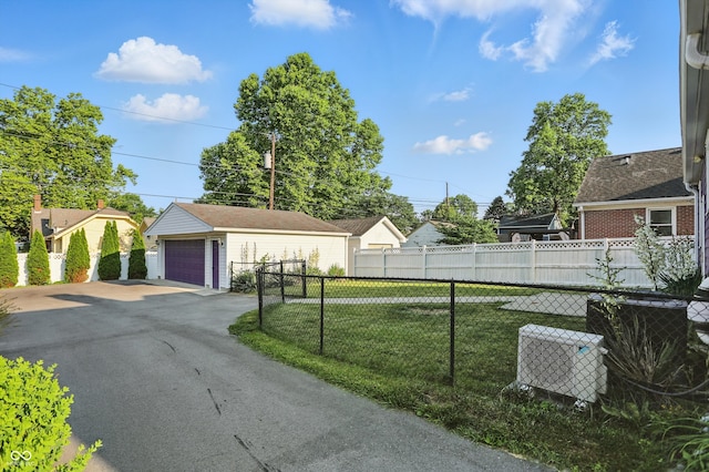 808 N Layman Ave, Indianapolis, IN 46219 - view of yard featuring a detached garage and an outbuilding