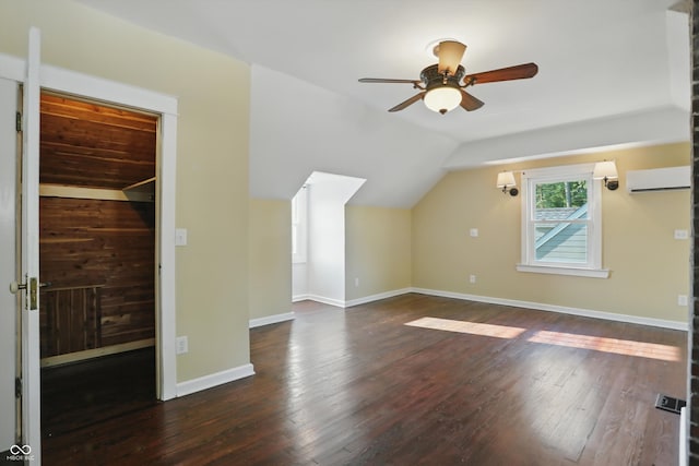808 N Layman Ave, Indianapolis, IN 46219 - additional living space featuring a wall mounted air conditioner, a ceiling fan, wood-type flooring, and vaulted ceiling