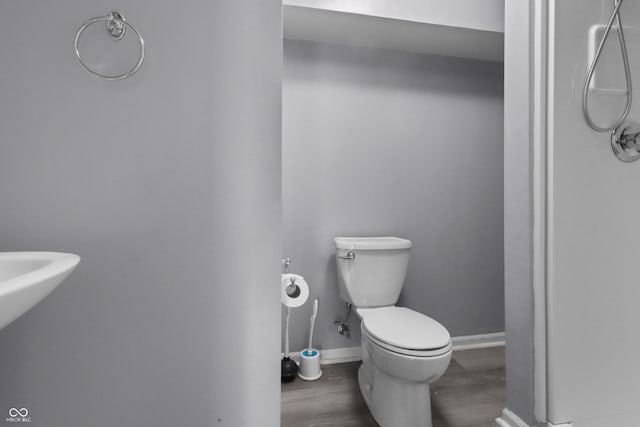 10312 Gladeview Dr, Indianapolis, IN 46239 - bathroom with toilet and wood finished floors