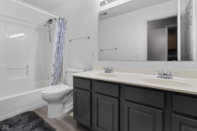10312 Gladeview Dr, Indianapolis, IN 46239 - bathroom featuring double vanity, wood finished floors, and shower / bath combo with shower curtain