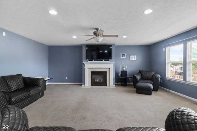 10312 Gladeview Dr, Indianapolis, IN 46239 - living room with carpet, a textured ceiling, ceiling fan, a fireplace with flush hearth, and recessed lighting