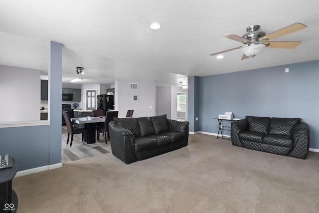 10312 Gladeview Dr, Indianapolis, IN 46239 - carpeted living area with a ceiling fan and recessed lighting