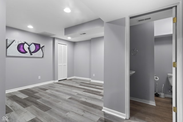 10312 Gladeview Dr, Indianapolis, IN 46239 - below grade area featuring wood finished floors and recessed lighting