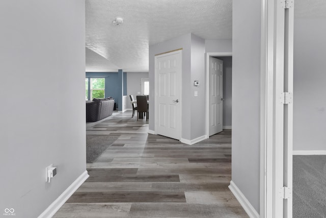 10312 Gladeview Dr, Indianapolis, IN 46239 - hall with a textured ceiling and wood finished floors