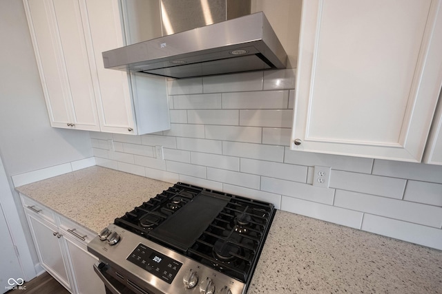 9671 Holborn Ave, Mccordsville, IN 46055 - kitchen featuring wall chimney range hood, stainless steel range with gas stovetop, decorative backsplash, and white cabinets
