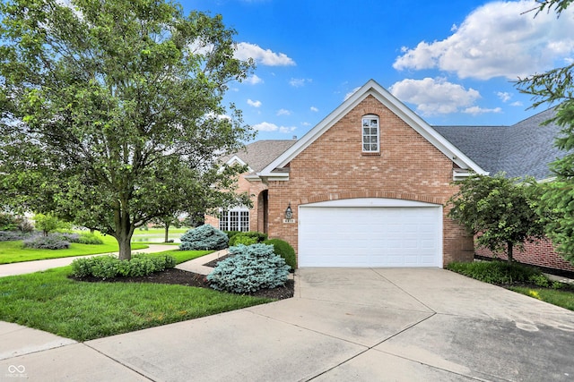 4810 Crystal River Ct, Indianapolis, IN 46240 - traditional home with brick siding, concrete driveway, roof with shingles, and a front lawn