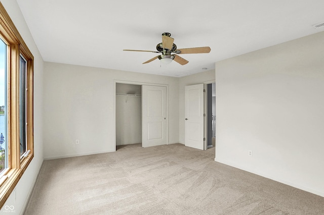 4810 Crystal River Ct, Indianapolis, IN 46240 - unfurnished bedroom with light colored carpet, a closet, and a ceiling fan