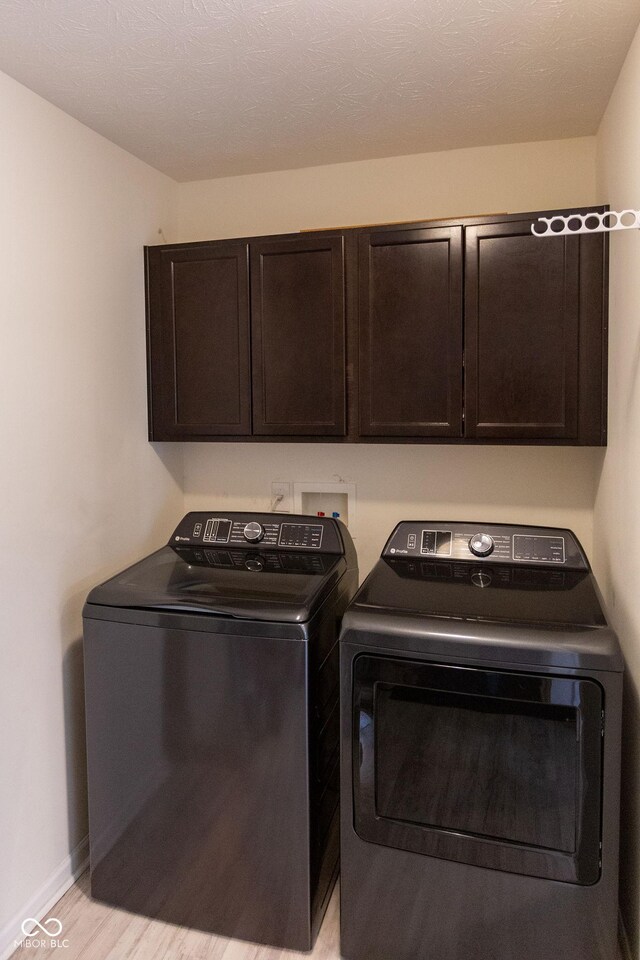 4353 W Parkway Ct, New Palestine, IN 46163 - washroom with cabinet space, independent washer and dryer, and baseboards