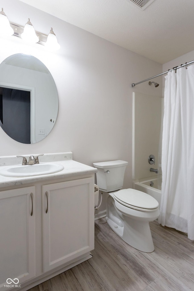 4353 W Parkway Ct, New Palestine, IN 46163 - bathroom with wood finished floors, vanity, toilet, and shower / bath combination with curtain